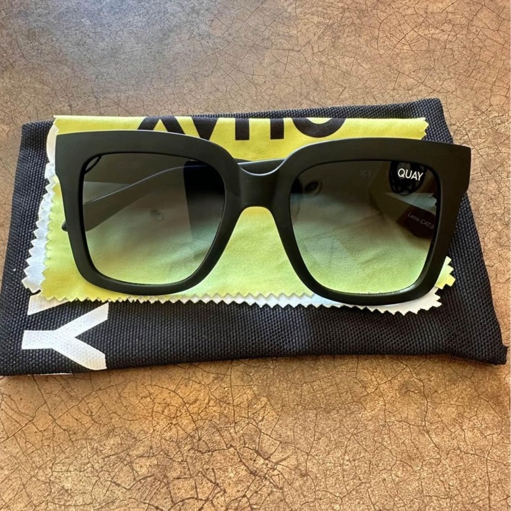 Quay green sunglasses.